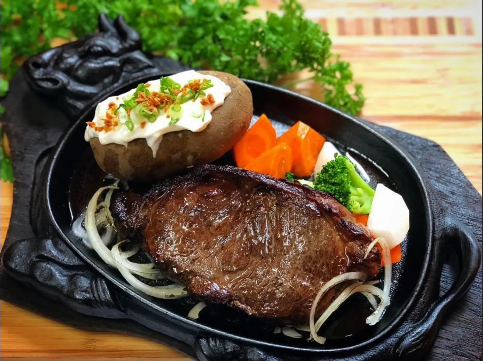 N.Z. ribeye steak served on a bull-shaped sizzling hotplate